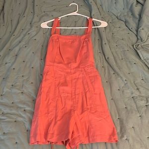 Womans orange short overall in a size medium